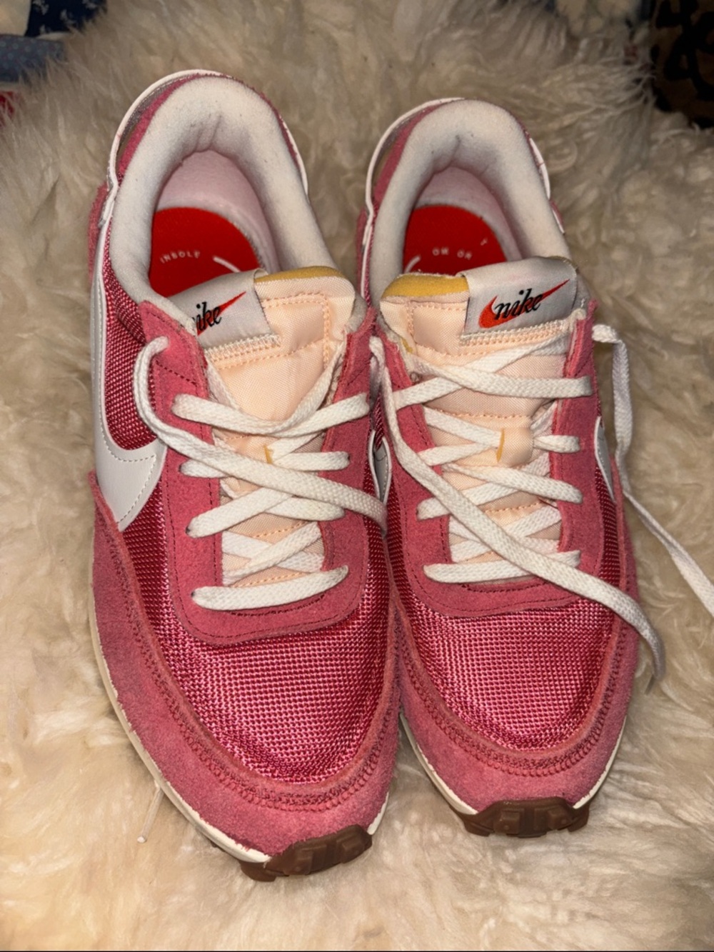 Nike coral pink and white suede low-top sneaker